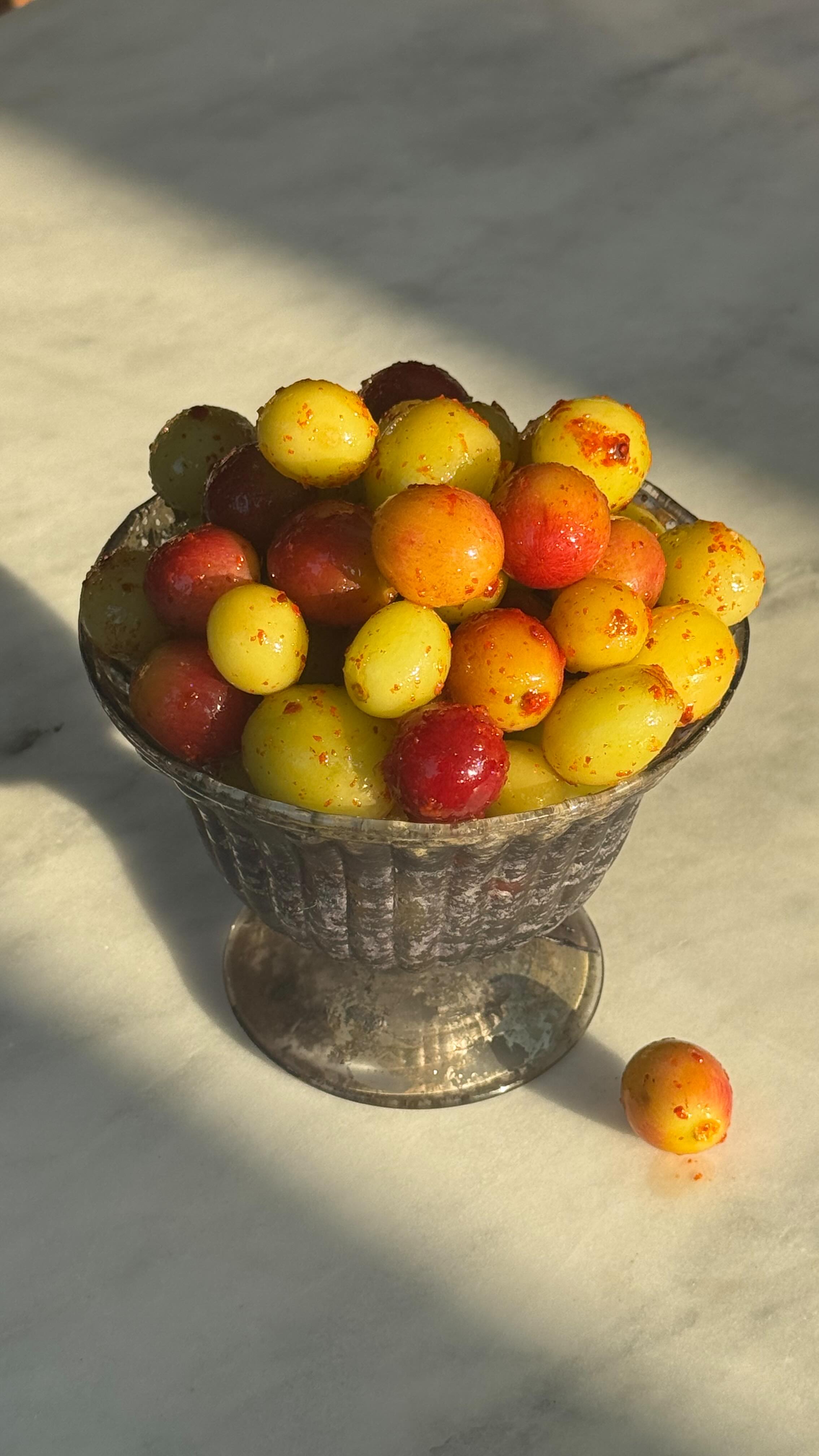 Instagram post by @zaynab_issa for NYT Cooking. Caption reads: Sweet and Salty Frozen Grapes. My latest recipe....