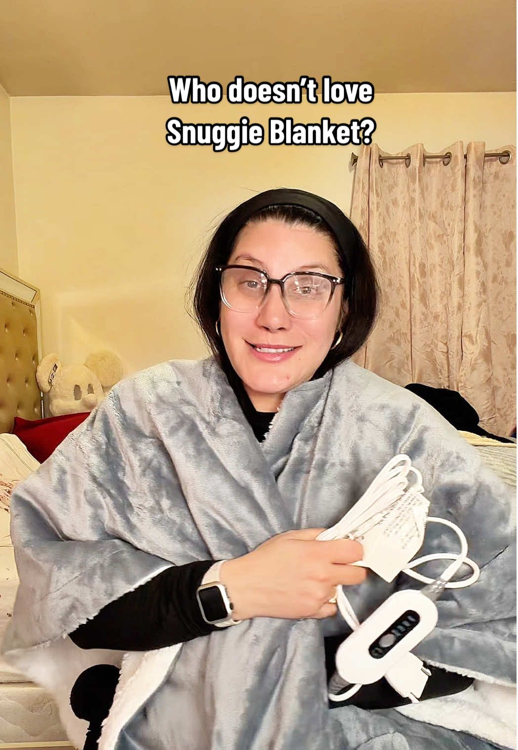 TikTok post by @lilxurious for Snuggie. Caption reads: [...] a blanket… this is it 🛋️✨ I live in my....
