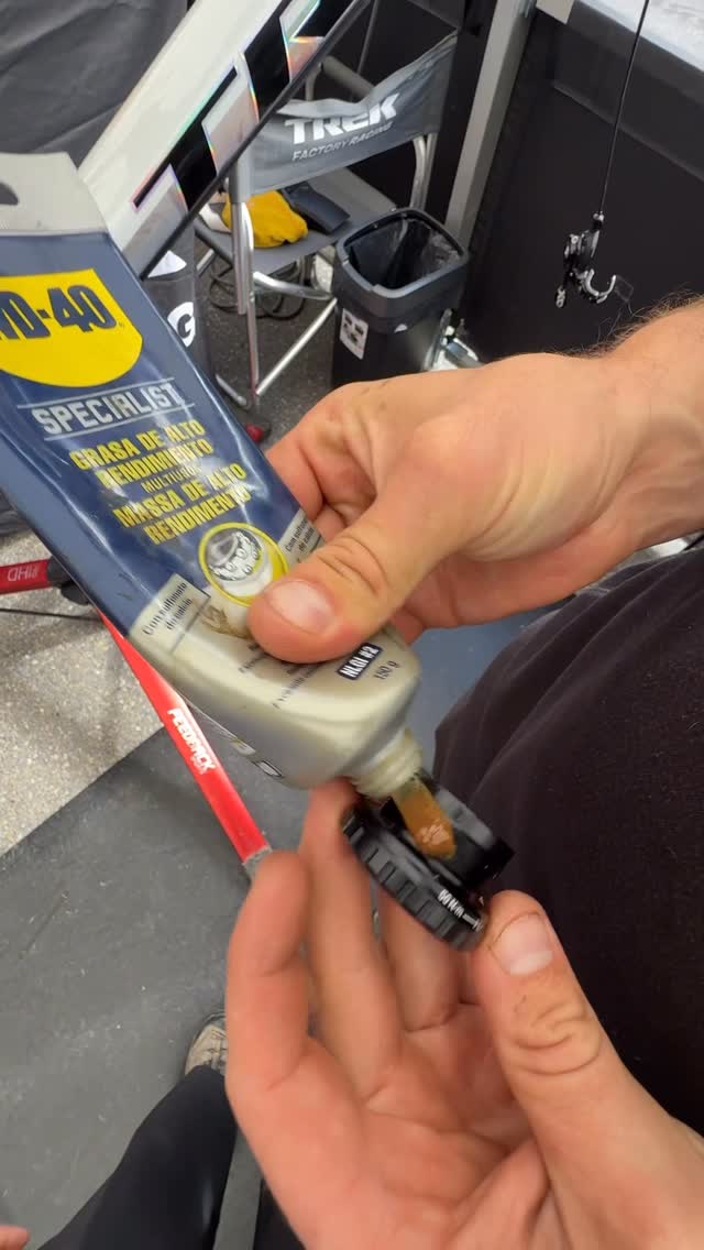 Instagram post by @trekfactoryracingdh for WD-40. Caption reads: Strip down, rebuild. It must be another World Cup....