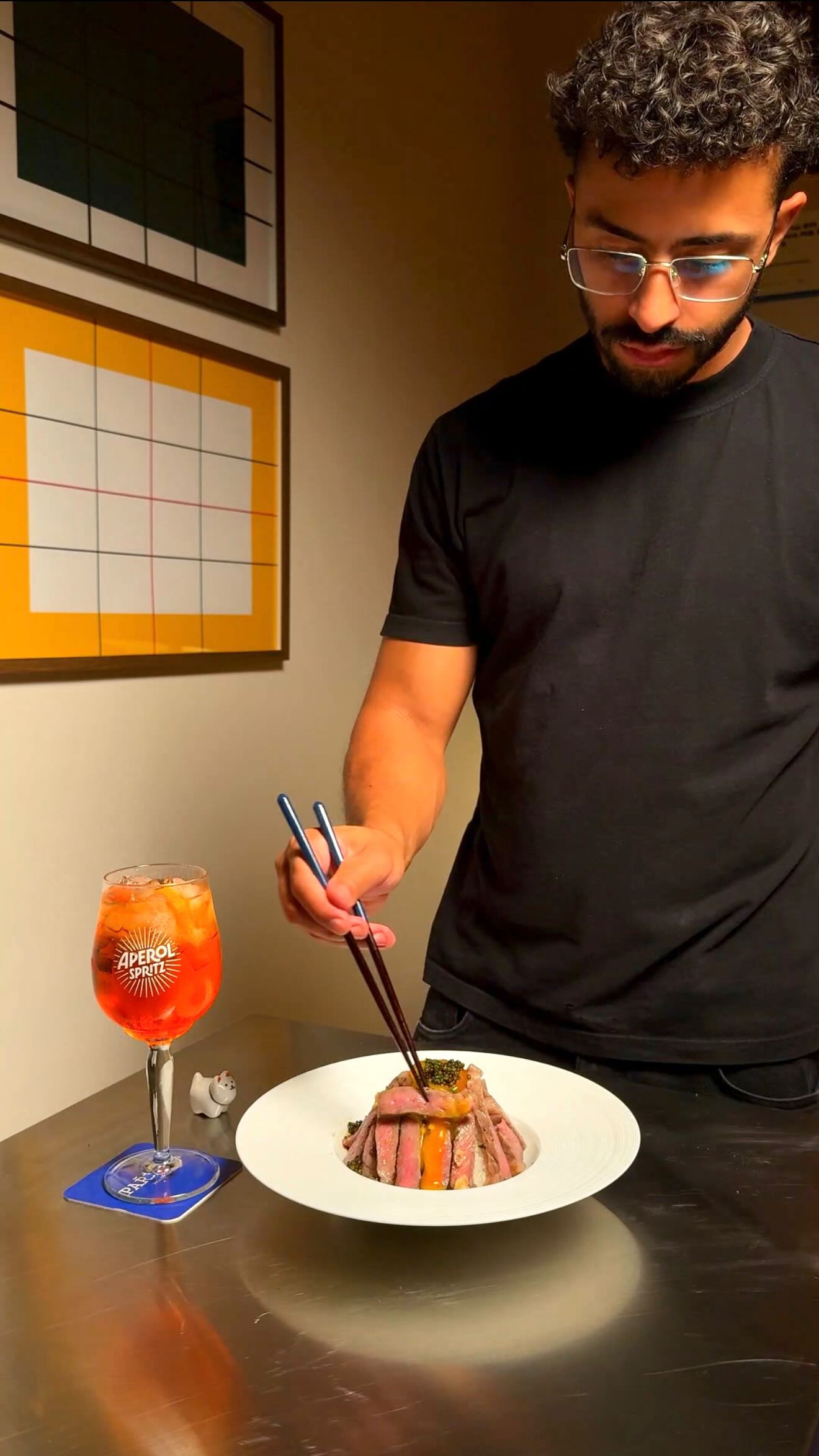 Instagram post by @rahmandaniel for Aperol Spritz. Caption reads: Wagyu Donburi s Aperolem 🥩🍹🍊
.
@warehouse1cz....