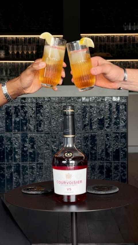 Instagram post by @alexsaunes for Courvoisier. Caption reads: [...] Celebrating our Father Figures with....