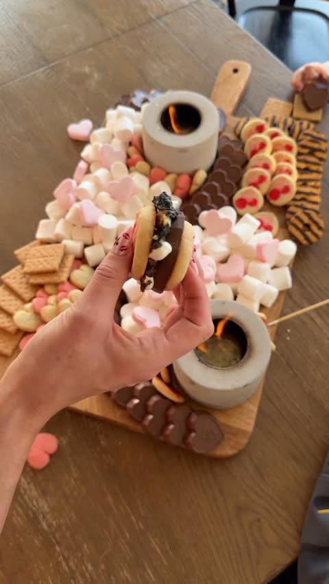 Instagram post by @samanthabauchmann for Feastables. Caption reads: VALENTINES S’MORES BOARD with @feastables //....