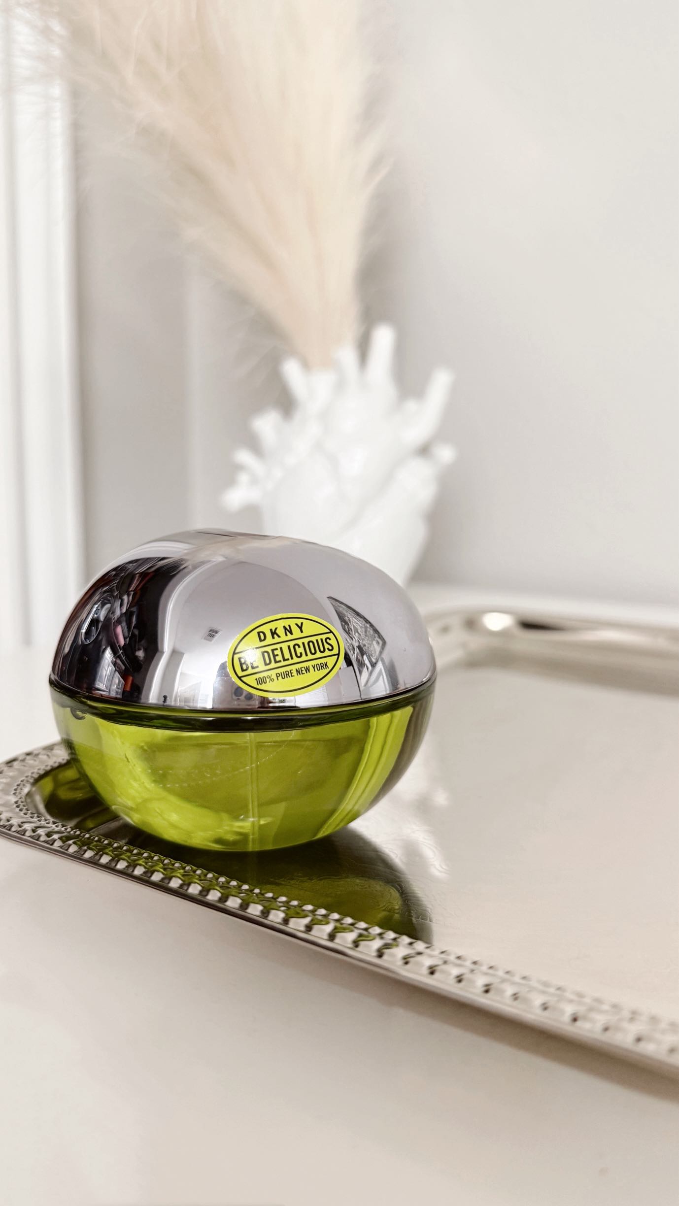 Instagram post by @karolsullivan for Ulta Beauty. Caption reads: #BeDelicious DKNY Cult-Classic Fragrance 🍏 @dkny....