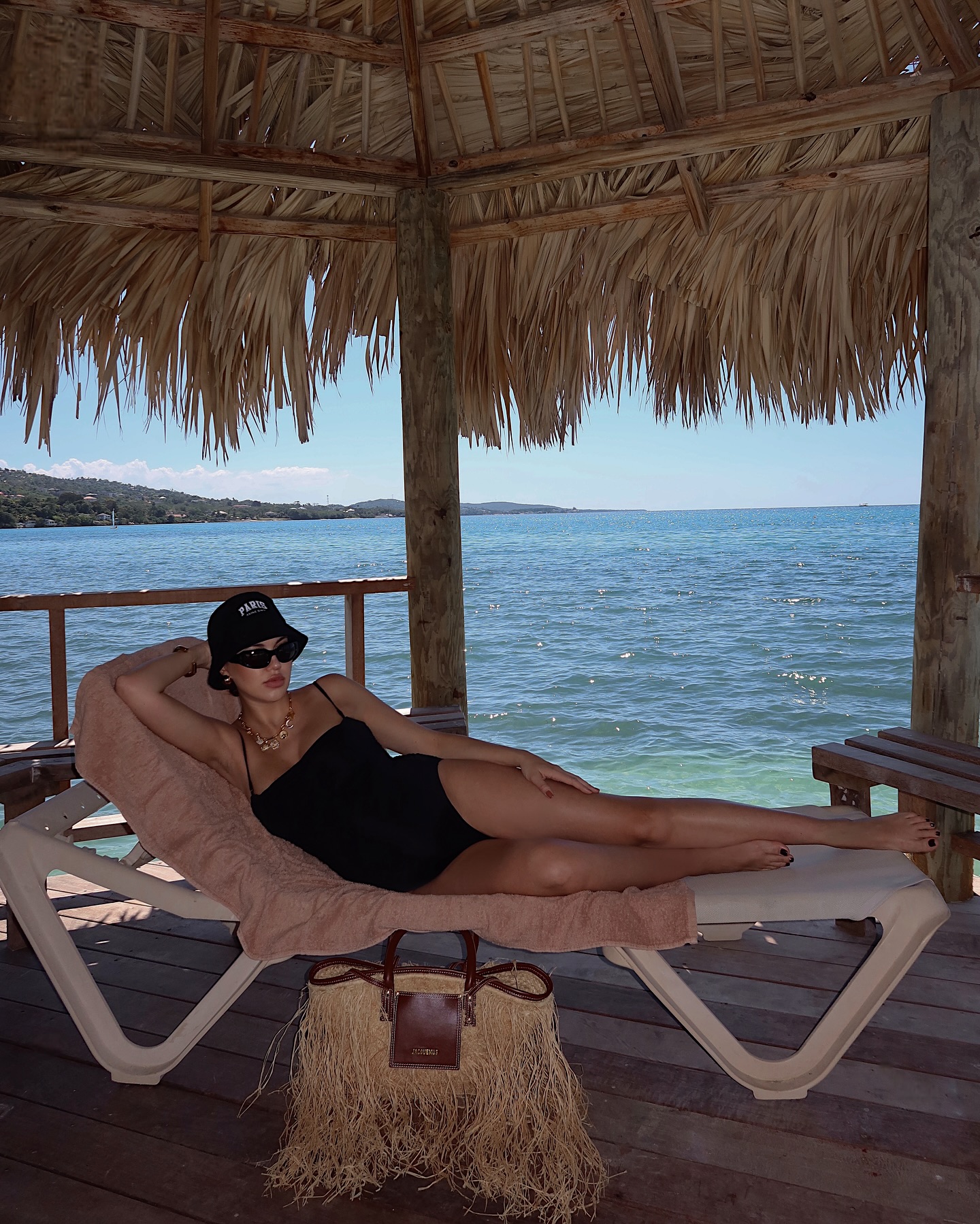Instagram post by @karinabnyc for Sandals Resorts. Caption reads: Sunny Jamaican escape with a new bundle in tow....