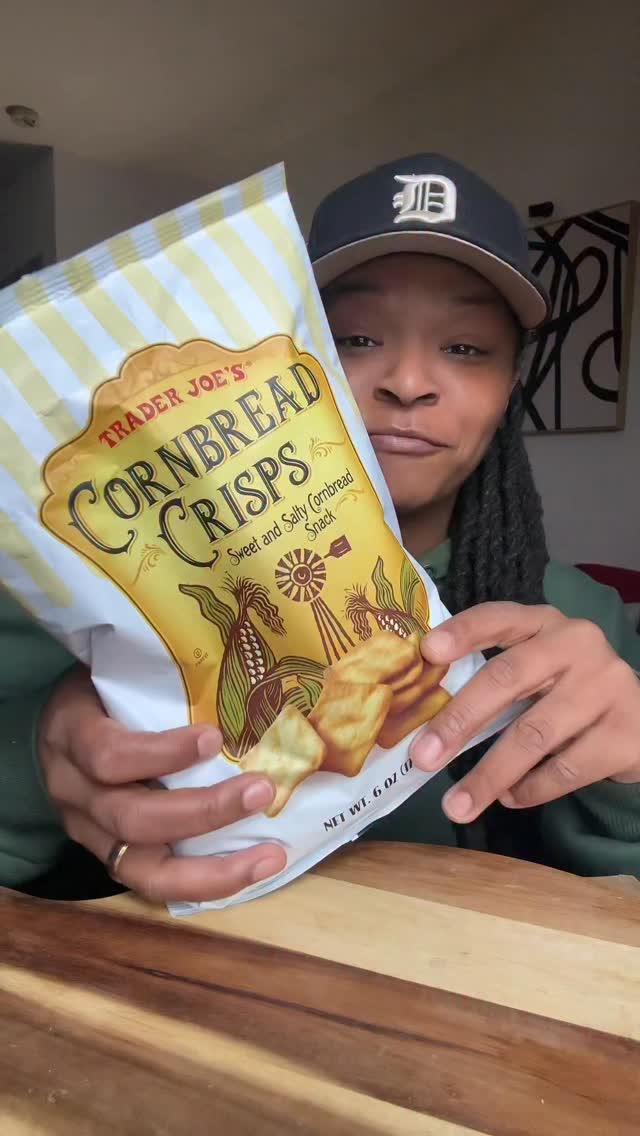 Instagram post by @munchwithdes for Trader Joe's. Caption reads: Trader Joe’s Cornbread Crisps Review — it’s worth....