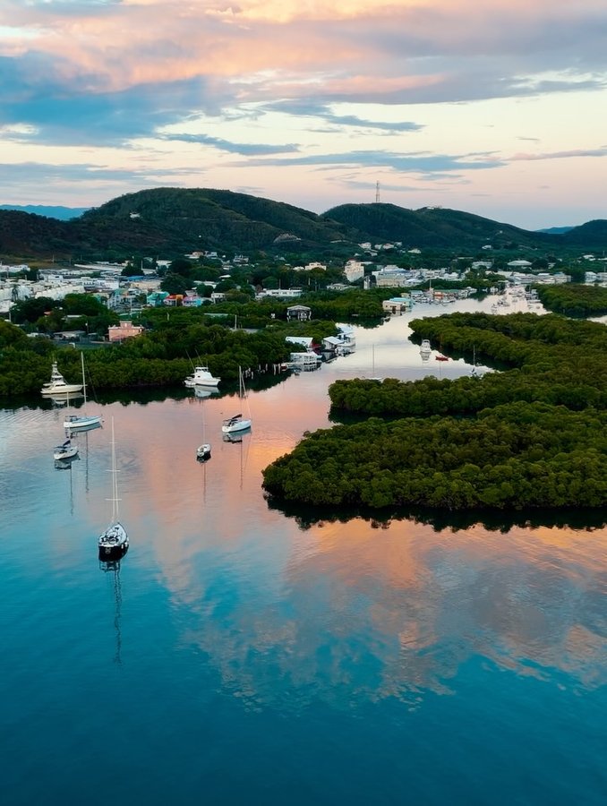 Instagram post by @colinringas for Discover Puerto Rico. Caption reads: [...] at Playa Doña Lala Beach 📍....