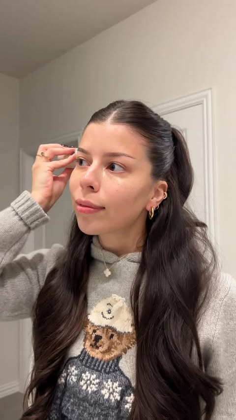 Instagram post by @elainamich for Tangle Teezer. Caption reads: Cute & easy half up half down tutorial 🤍☃️🫶🏻....