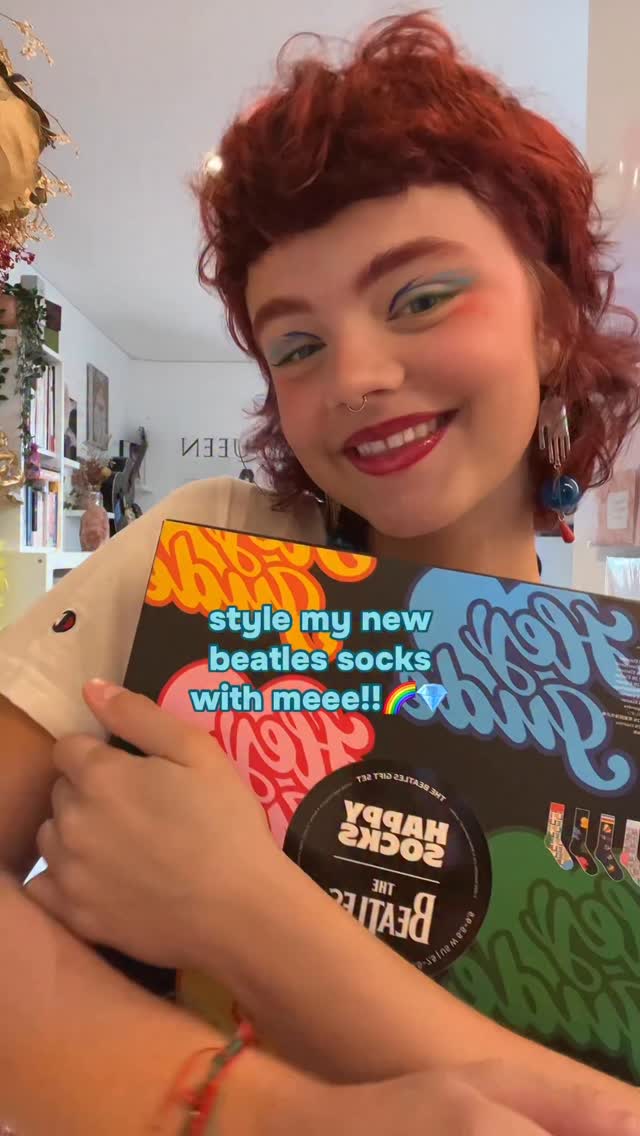 Instagram post by @victoriawestofficialx for Happy Socks. Caption reads: @happysocks I LOVE THESEEEEEE MWUAH🌈🌷 

#grwm....