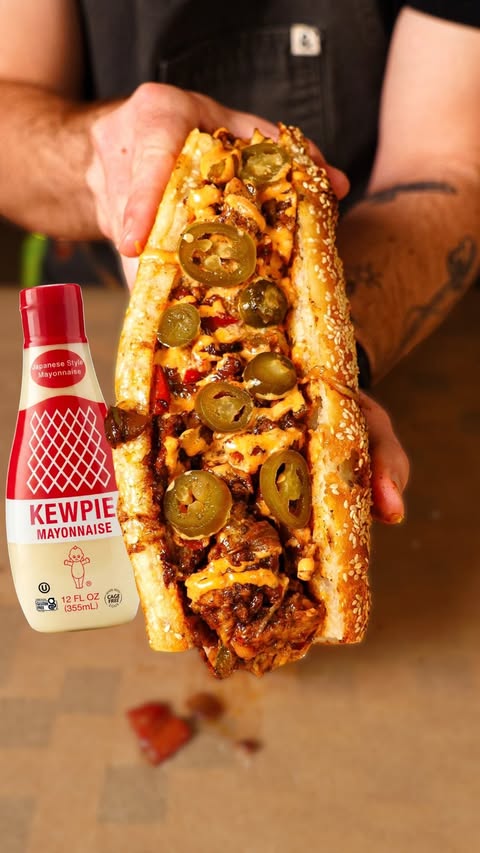 Instagram post by @dylannobert for Kewpie. Caption reads: [...] a camping trip gone wrong 🏕️ Sponsored....