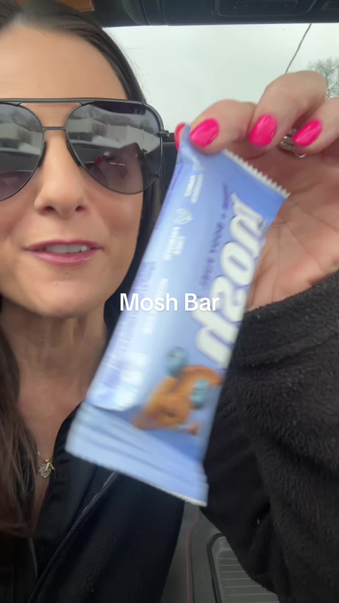 TikTok post by @mandiehunter_ for MOSH. Caption reads: [...] tried these protein bars yet it’s a must....