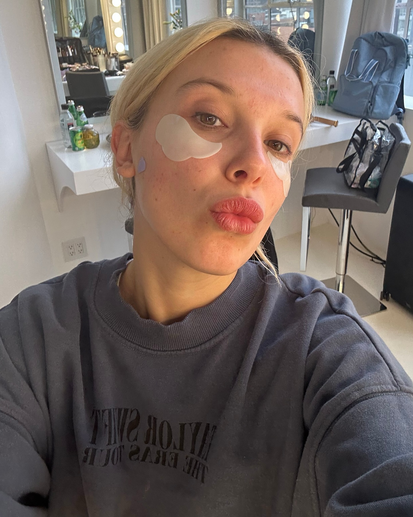 Instagram post by @milliebobbybrown for florence by mills. Caption reads: just a girl w/ her on-set faves ☁️

p.s. shop all....