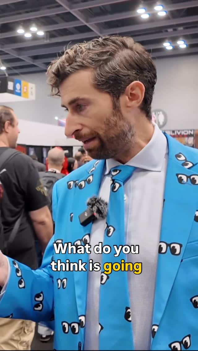 Instagram post by @scottrogowsky for Shinesty. Caption reads: [...] questions… 🧡💙🧡
.
.
.
Suit by....