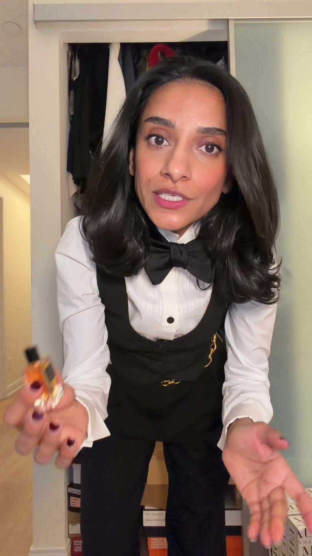 TikTok post by @sommyyah for The Row. Caption reads: [...] my tie skills. #oots #grwm #suittok @Loro....