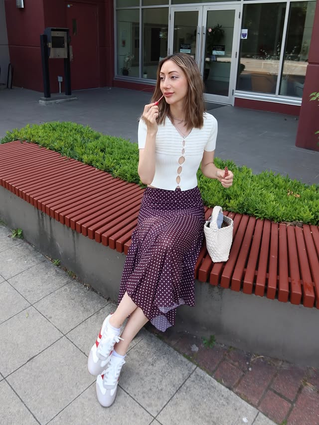 Instagram post by @mel.zzie for JustFab. Caption reads: [...] . . Skirt @peppermayo #peppermayo Shoes....