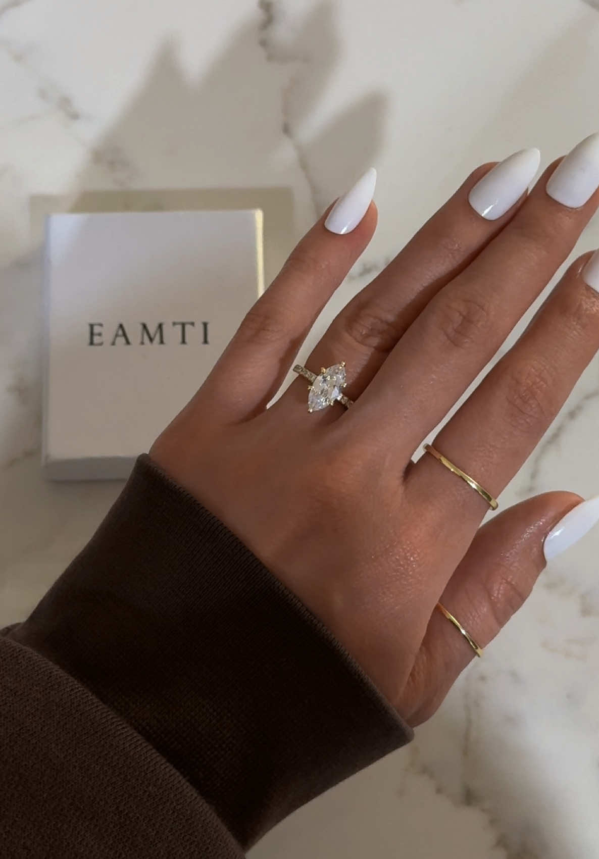 TikTok post by @leahfrzr for EAMTI Jewelry. Caption reads: the marquise ring from @EAMTI Jewellery is....
