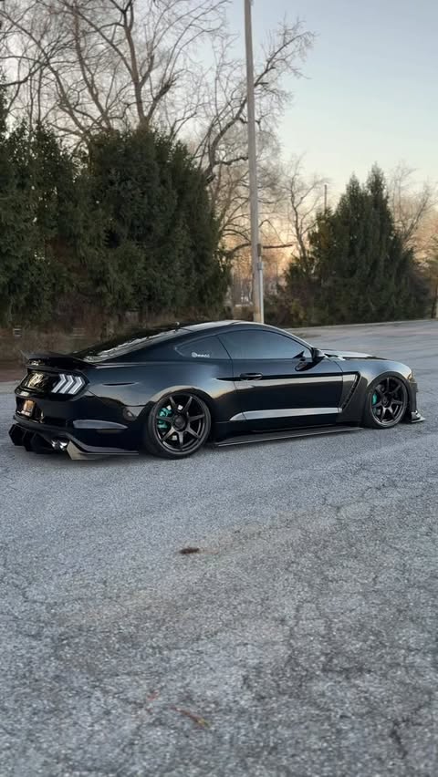 Instagram post by @mustang_access for 10 Second Racing. Caption reads: All black fits >> - - ⬇️ use code “bekahs5.0” to....