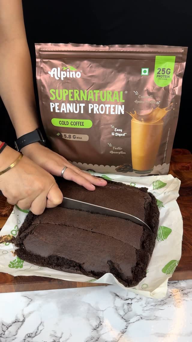 Instagram post by @indian_asmr_world for Alpino. Caption reads: Healthy & Protein Rich Brownies ASMR || #AD....