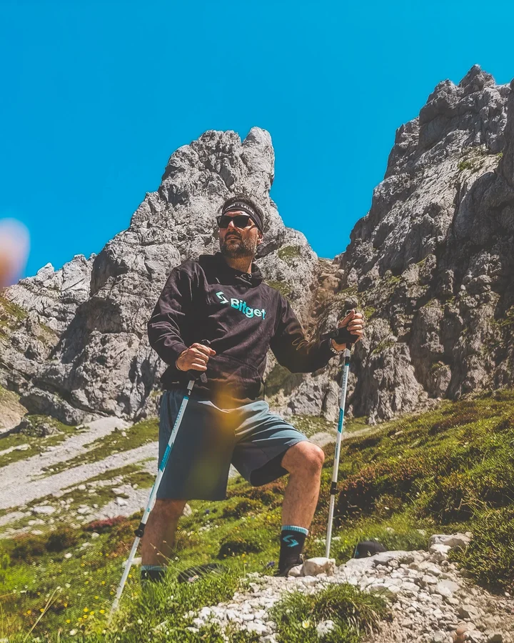 Instagram post by @tonydec_ for Bitget. Caption reads: [...] the top? Enjoy it. 🧗‍♂️🚀 Powered by....