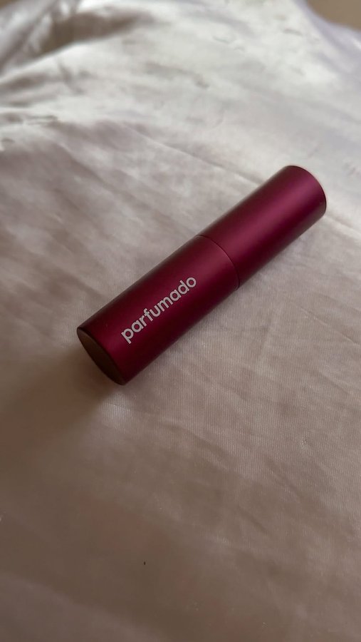 Instagram post by @byeamy for Parfumado. Caption reads: Take your perfume on-the-go and smell good all day....