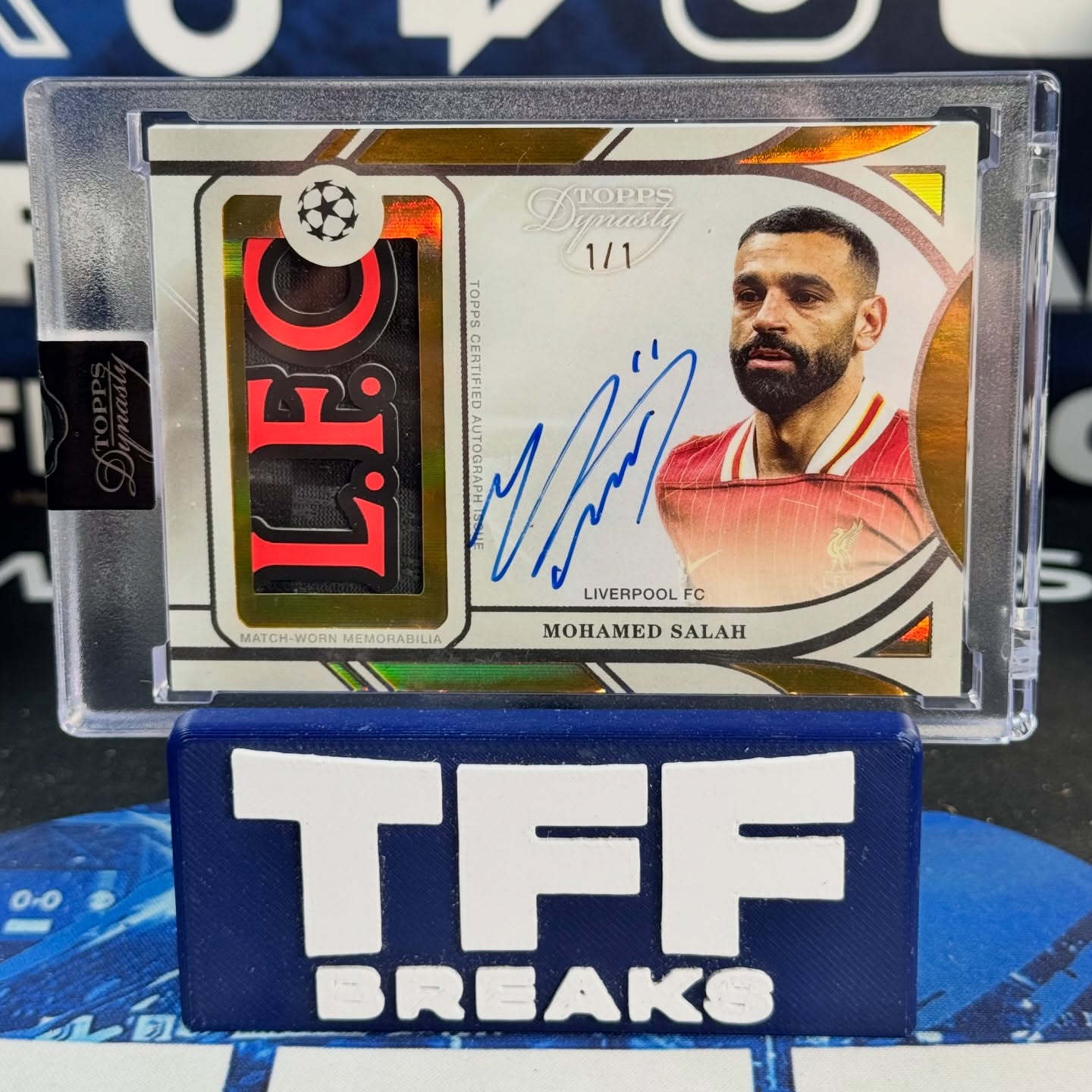 Instagram post by @tffbreaks for Topps. Caption reads: MO SALAH 1/1 👑 @toppsfc UCC Dynasty 2025 😍....