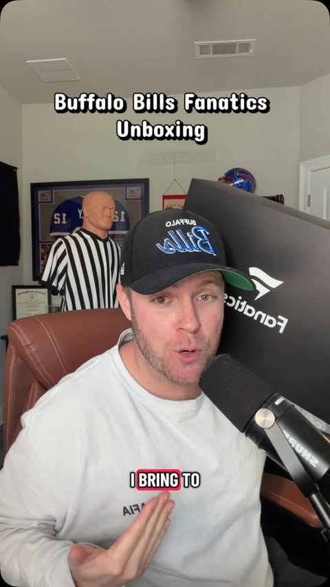 Instagram post by @realdanmitchell for Fanatics. Caption reads: Buffalo Bills UNBOXING! @Fanatics @NFL #rivalries....