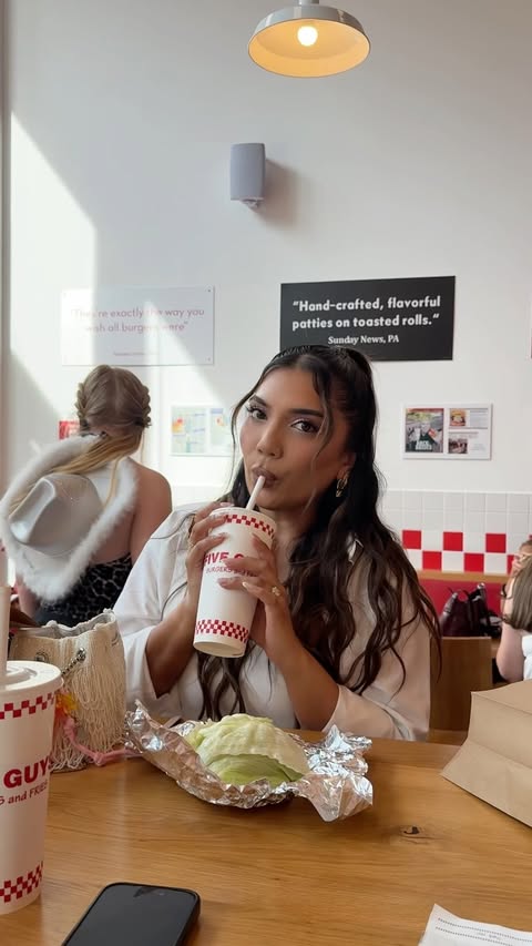 Instagram post by @kajalxo for Five Guys Burgers & Fries. Caption reads: concert prep the right way with @fiveguysuk....
