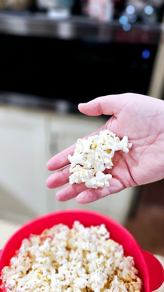Instagram post by @outnumberedmama for Zulay Kitchen. Caption reads: IDK about yall but #popcorn is a perfect....
