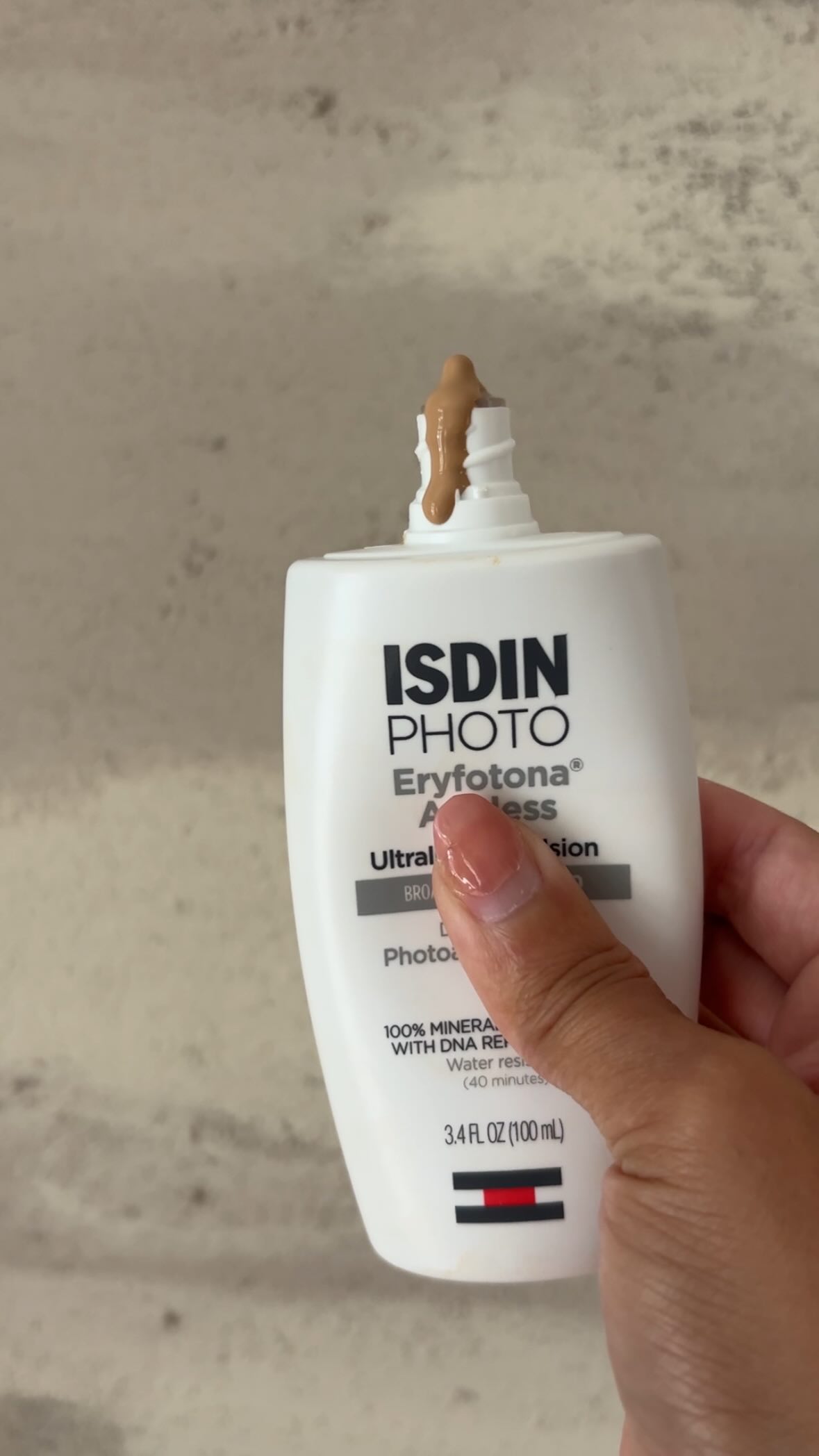 Instagram post by @laurascottandco for ISDIN. Caption reads: Highlighting a dermatologist favorite tinted....