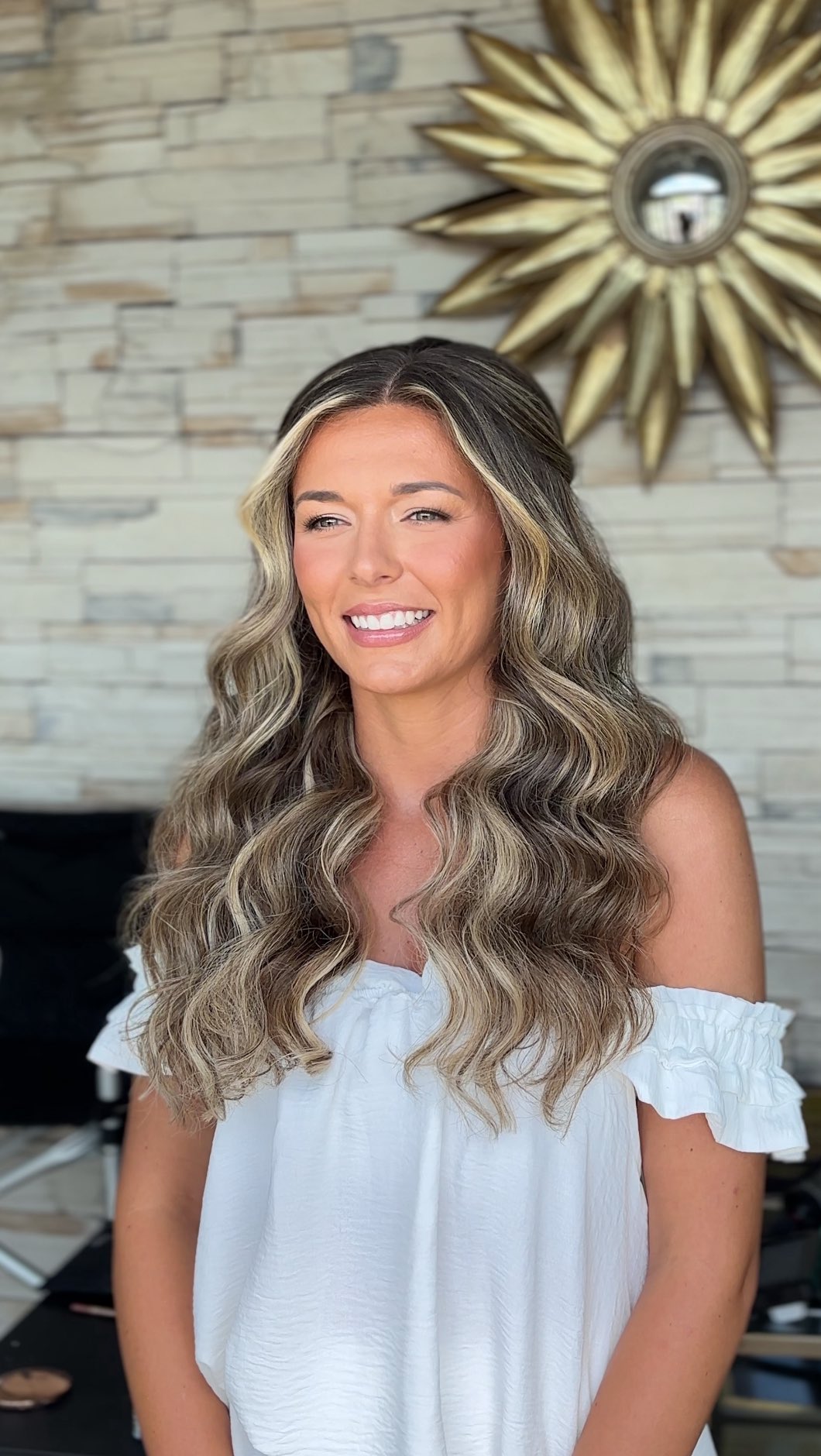 Instagram post by @ashleyglazerhair for Melinda Maria. Caption reads: Wind & beach waves usually don’t mix… but when you....