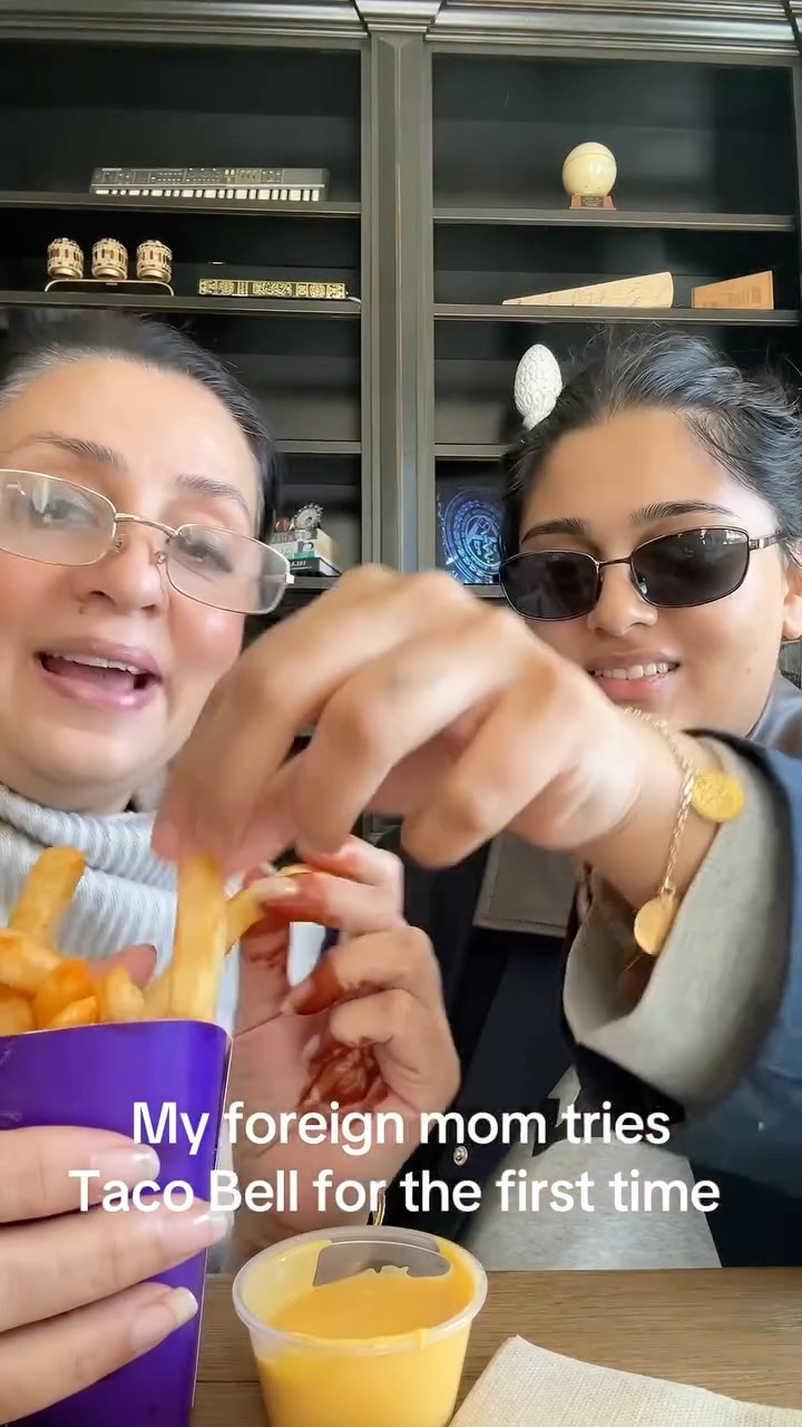 Instagram post by @jovkhann for Taco Bell. Caption reads: What should I make her eat next #momgoals #lol....