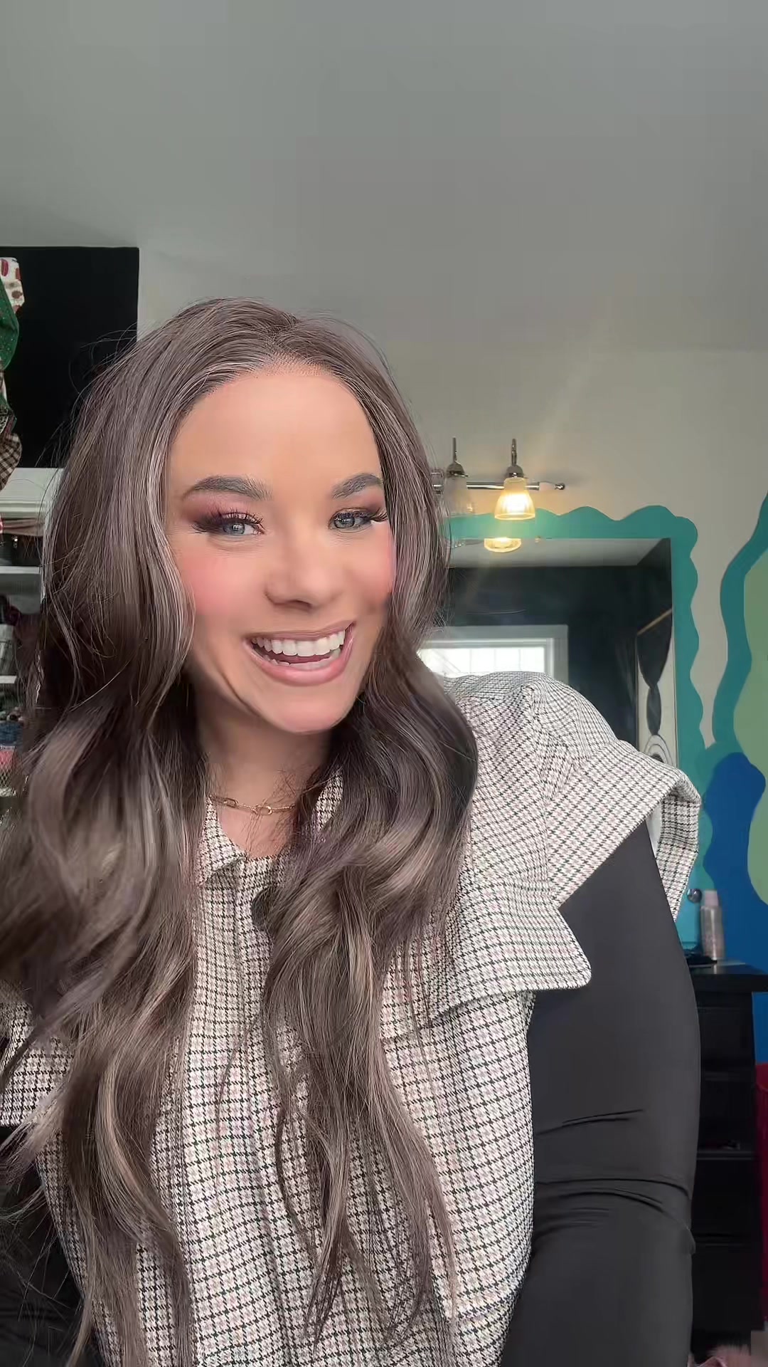 TikTok post by @elizabethwearswigs for Chelsey Smith Cosmetics. Caption reads: Callen Smoke Brunette from @Chelsey Smith Crowns....