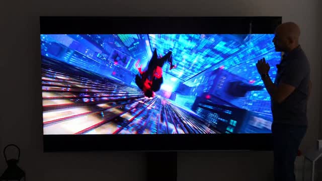 Instagram post by @dapoets42 for TCL USA. Caption reads: The TCL QM8L SQD-MiniLED TV is feature rich,....