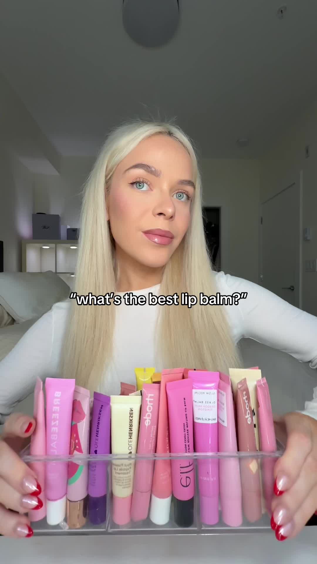 TikTok post by @lifeofshauni for OLEHENRIKSEN. Caption reads: what’s the best lip balm?? 🎀✨ #makeuphaul....