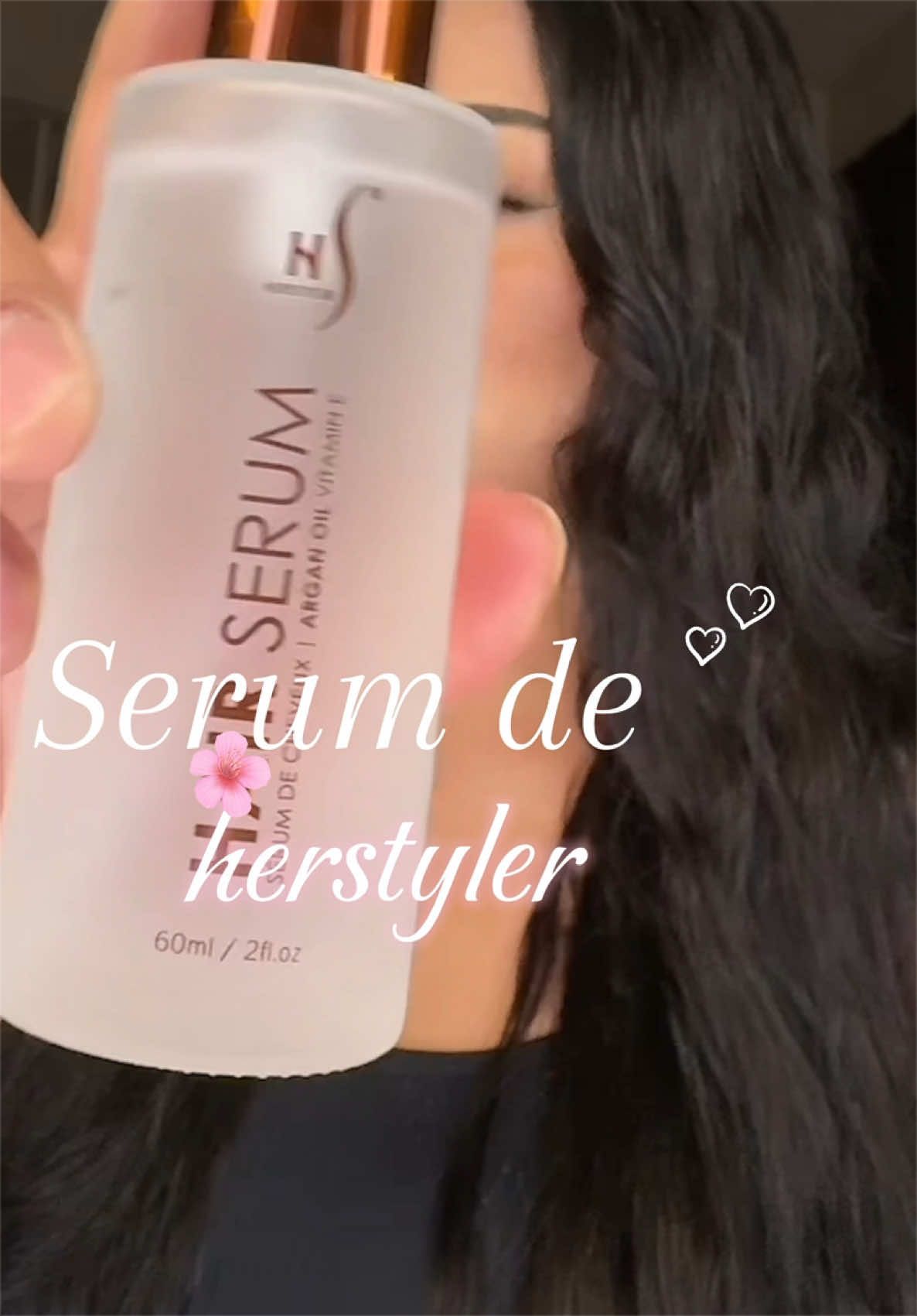 TikTok post by @arlethdarck for HerStyler Haircare. Caption reads: #serum #hair #hairstyle #hairserum #beauty....