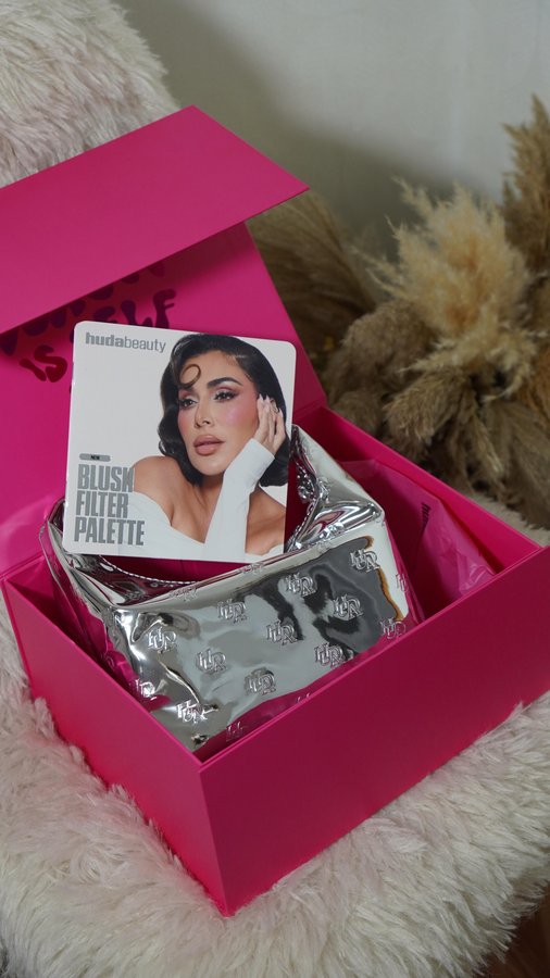 Instagram post by @mariami___k for Huda Beauty. Caption reads: Unboxing the new Huda box-pure beauty heaven....