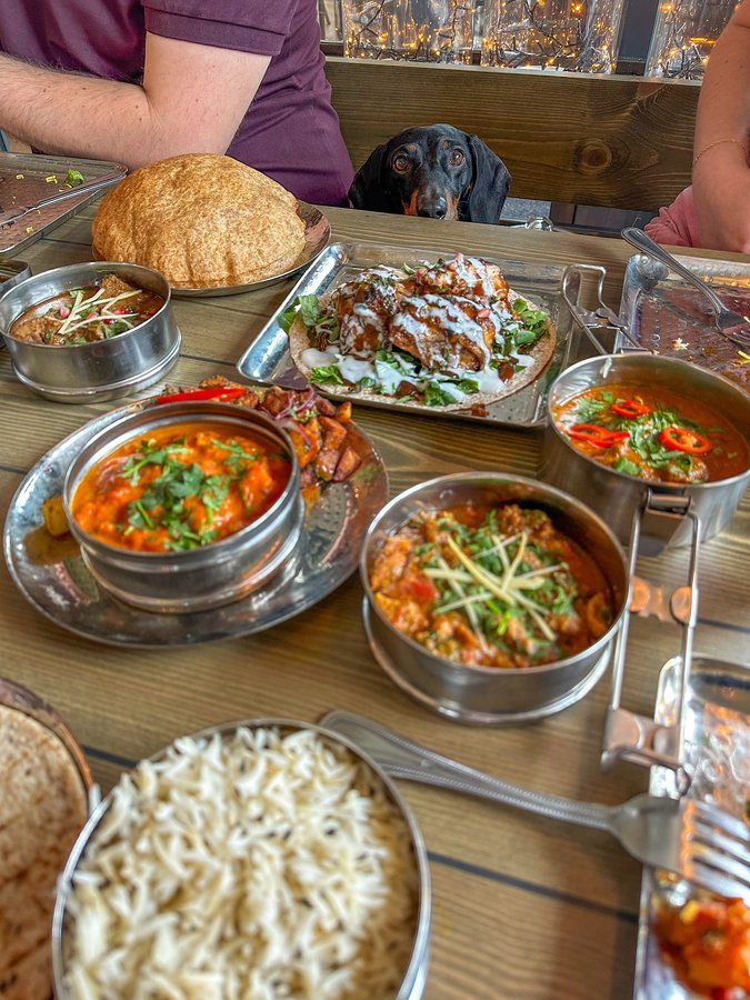 Instagram post by @hectorthesausage for Mowgli Street Food. Caption reads: Super exciting that @mowglistreetfood has arrived....