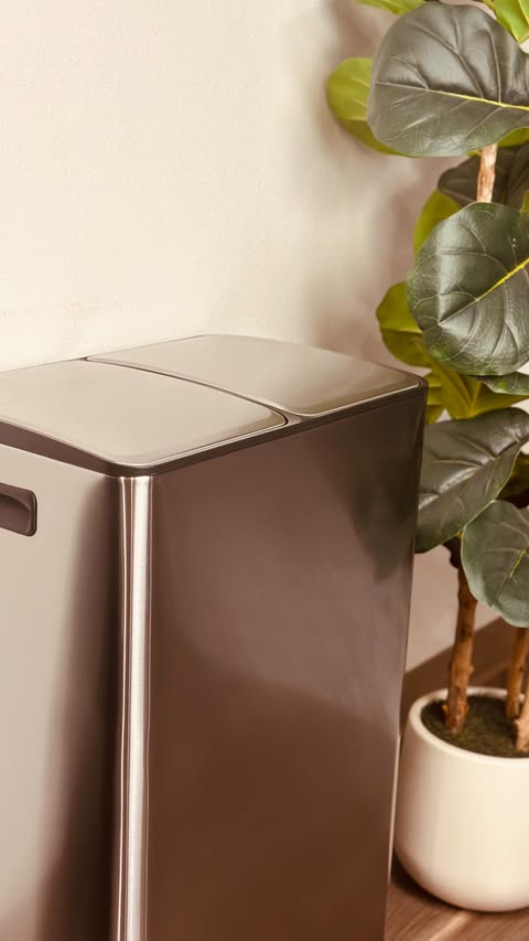 Instagram post by @galinafertsovich for Garvee. Caption reads: This dual trash can = instant kitchen upgrade....