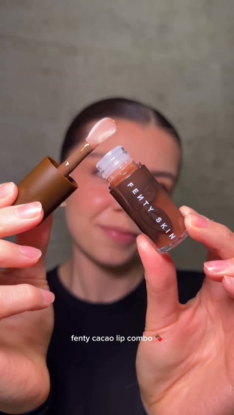 Instagram post by @rebeccariddlex for FENTY SKIN. Caption reads: asmr fenty cacao lip combo sounds🍫 @fentyskin 🤎....