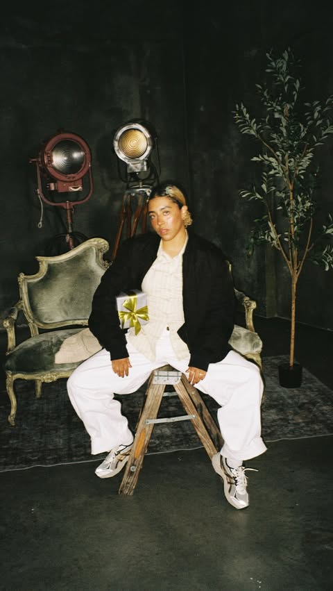 Instagram post by @karacannella for Urban Outfitters. Caption reads: [...] holiday without @asics_sportstyle x....