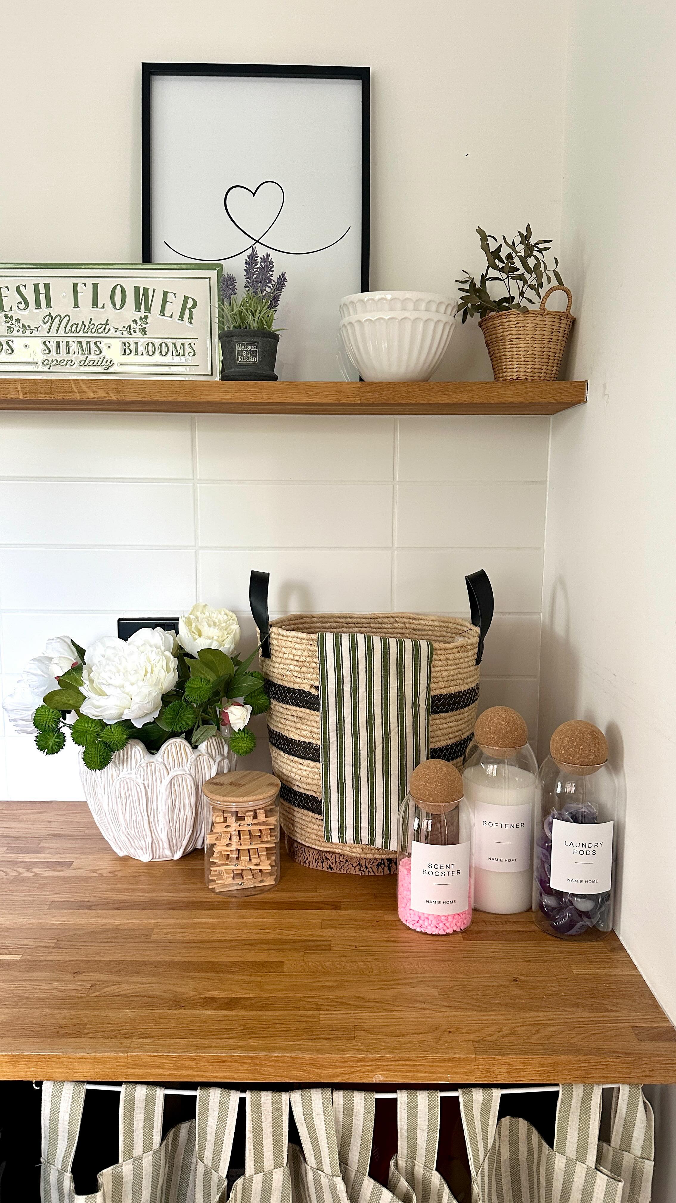 Instagram post by @homebyholli for NAMIE HOME. Caption reads: Refill my laundry products with me 🧼🧺🫧

Happy....