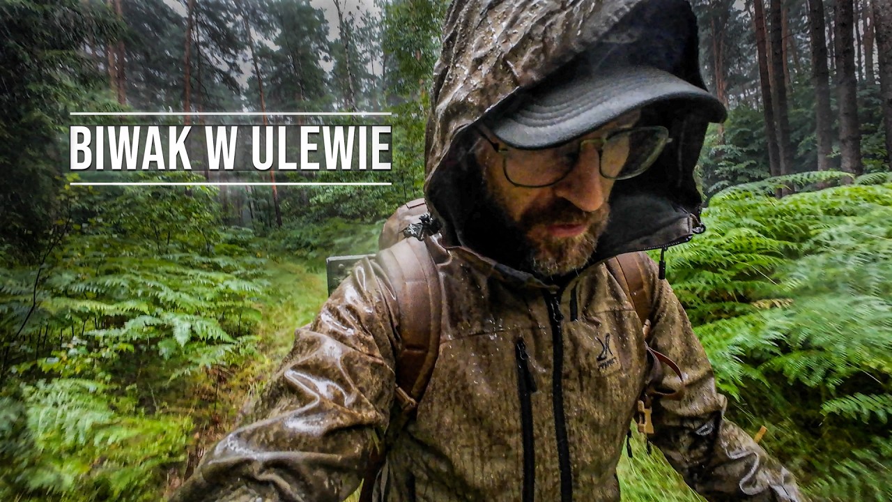 YouTube post by @Bushcraftowy for E-Militaria. Caption reads: Camping in the pouring rain solo - fire, shelter....