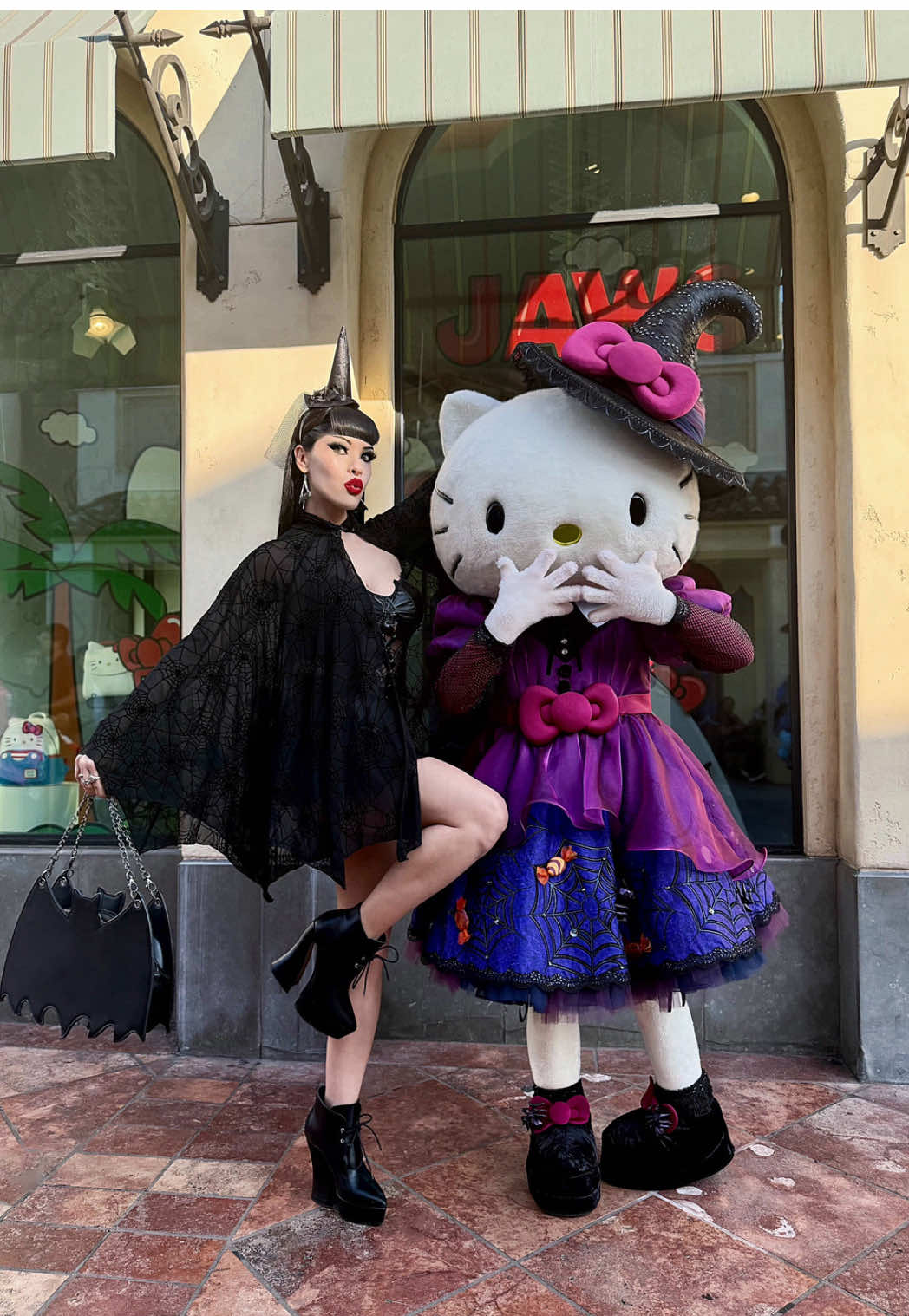 TikTok post by @victoriaveninofficial for Hello Kitty. Caption reads: 🖤🥀🦇🔮🦇🥀🖤 Monday Fright at Universal Studios....