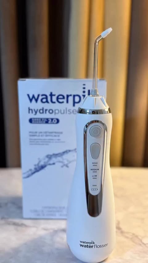 Instagram post by @learnurduwith_me for Waterpik Oral Health. Caption reads: @waterpik is the #1 water flosser brand....
