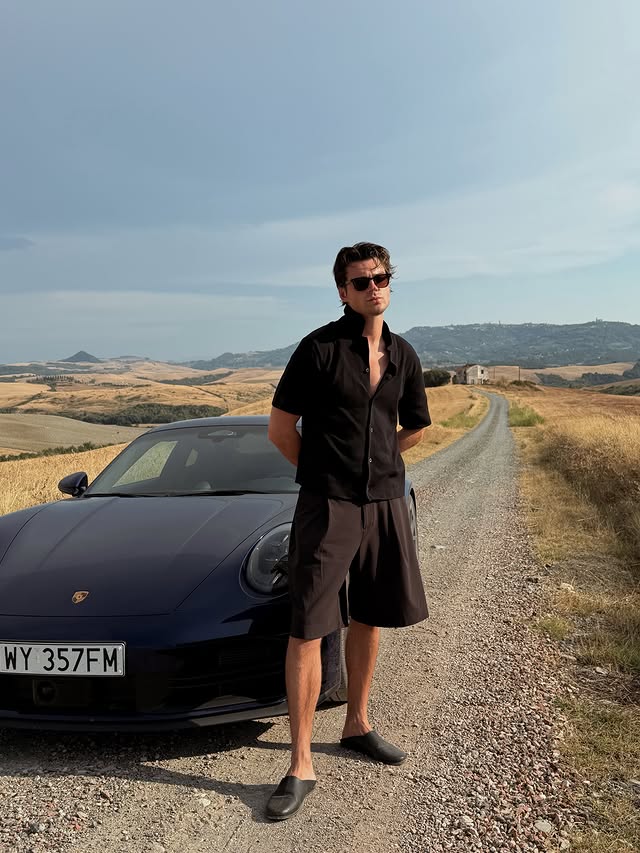 Instagram post by @maksbehr for Porsche. Caption reads: Our lovely trip to Tuscany in 911 Carrera 4S 🖤....
