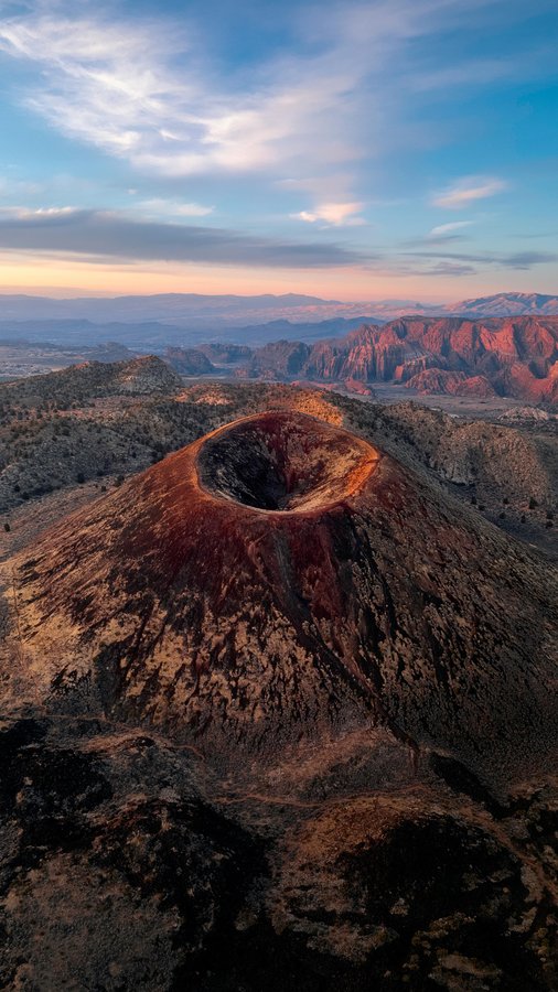 Instagram post by @v_outdoors for Visit Utah. Caption reads: Exploring Diamond Valley Cinder Cone was an unreal....