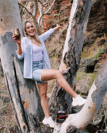 Instagram post by @agirltastingwhiskey for Woodford Reserve. Caption reads: #ad Fun fact about me- I’ve always been obsessed....