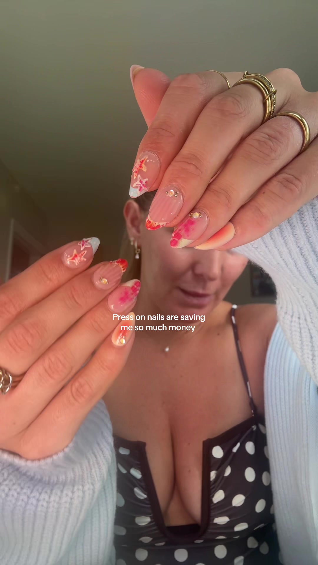 TikTok post by @emmatwinmum for Ellie Young Beauty Shop. Caption reads: Press on nails are saving me so much money and....