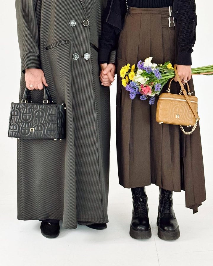 Instagram post by @omr94 for Etienne Aigner AG. Caption reads: 💐🤍.