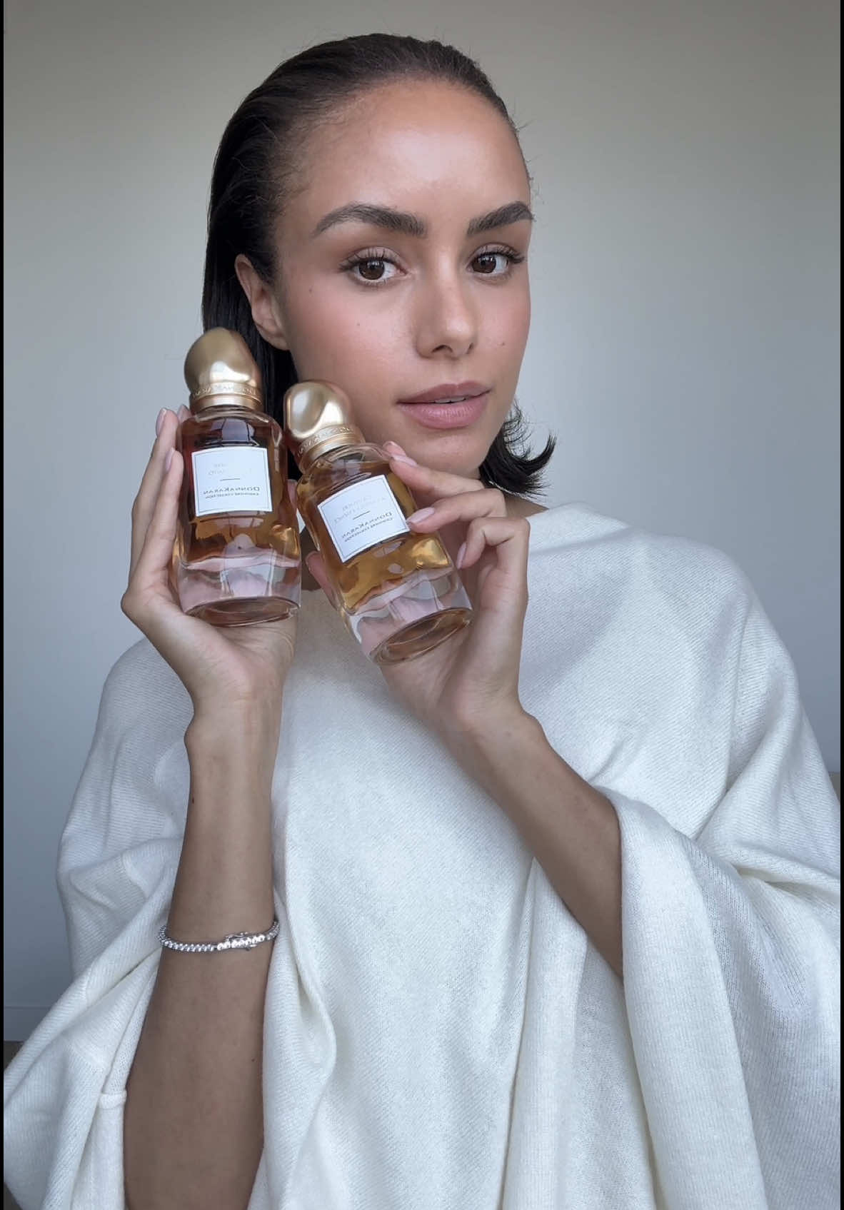 TikTok post by @oliviaamcdowell for Donna Karan. Caption reads: [...] dream fragrance duo from spring from @Donna....