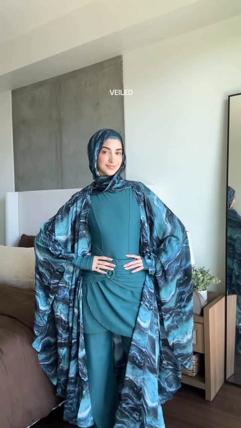 Instagram post by @norhansdiary for Veiled. Caption reads: New veiled swimwear 🤍🌊 @veiledcollection use....